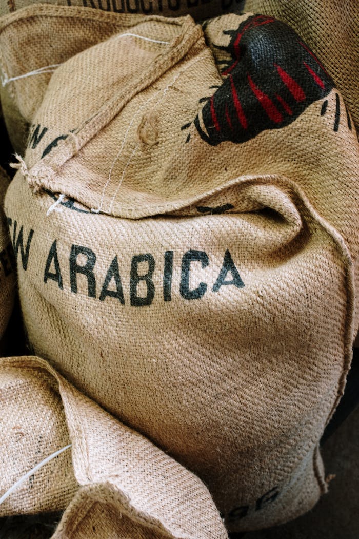Detailed image of a burlap sack labeled with Arabica coffee beans.